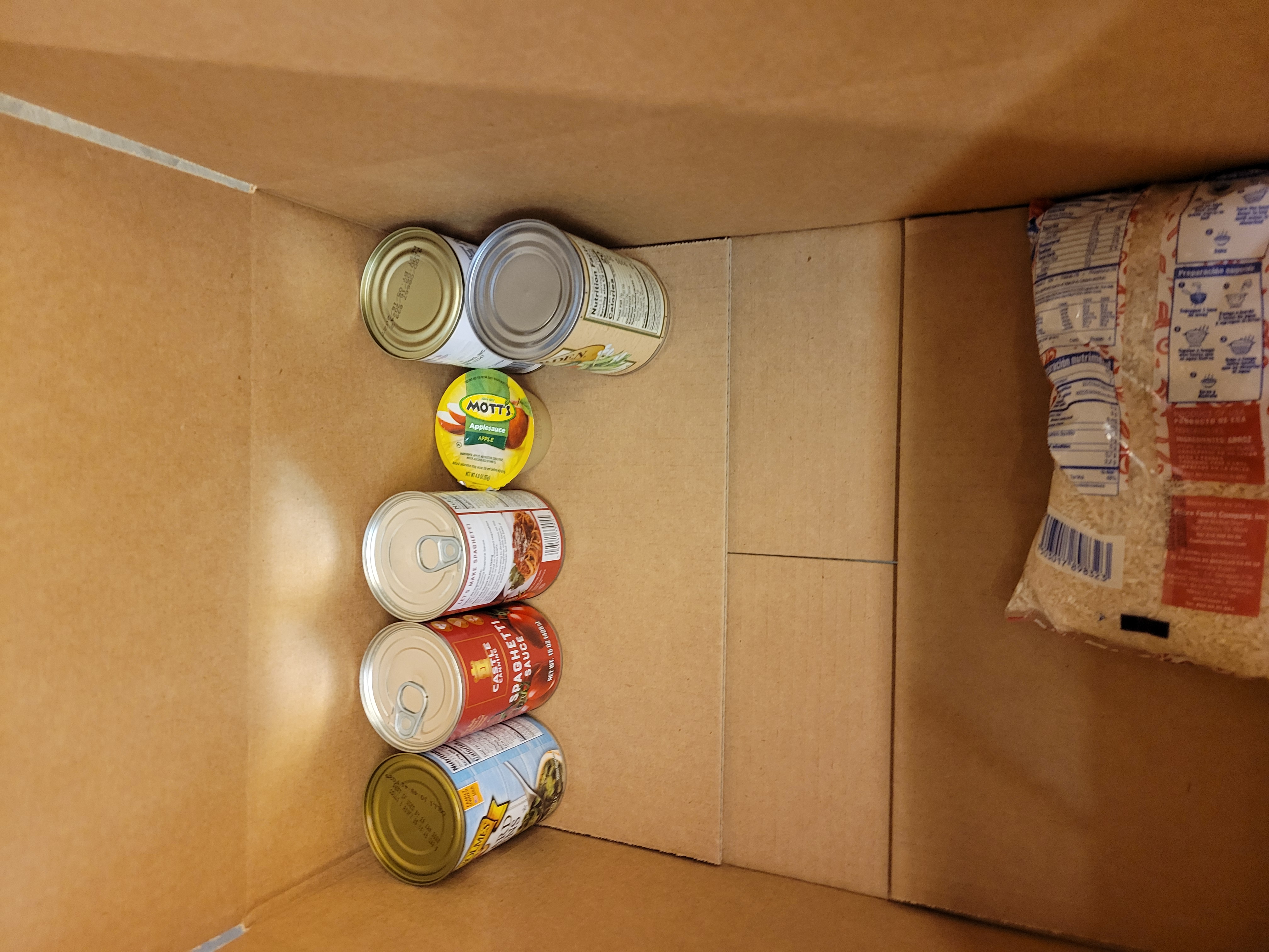 Cardboard box with very little dry goods.